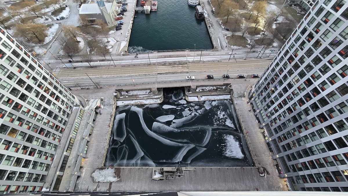 Aerial photo of Peter Street Basin in winter, surrounded by high-rise buildings